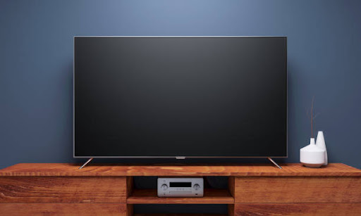 Black Smart Tv Mockup on wooden console. 3d rendering